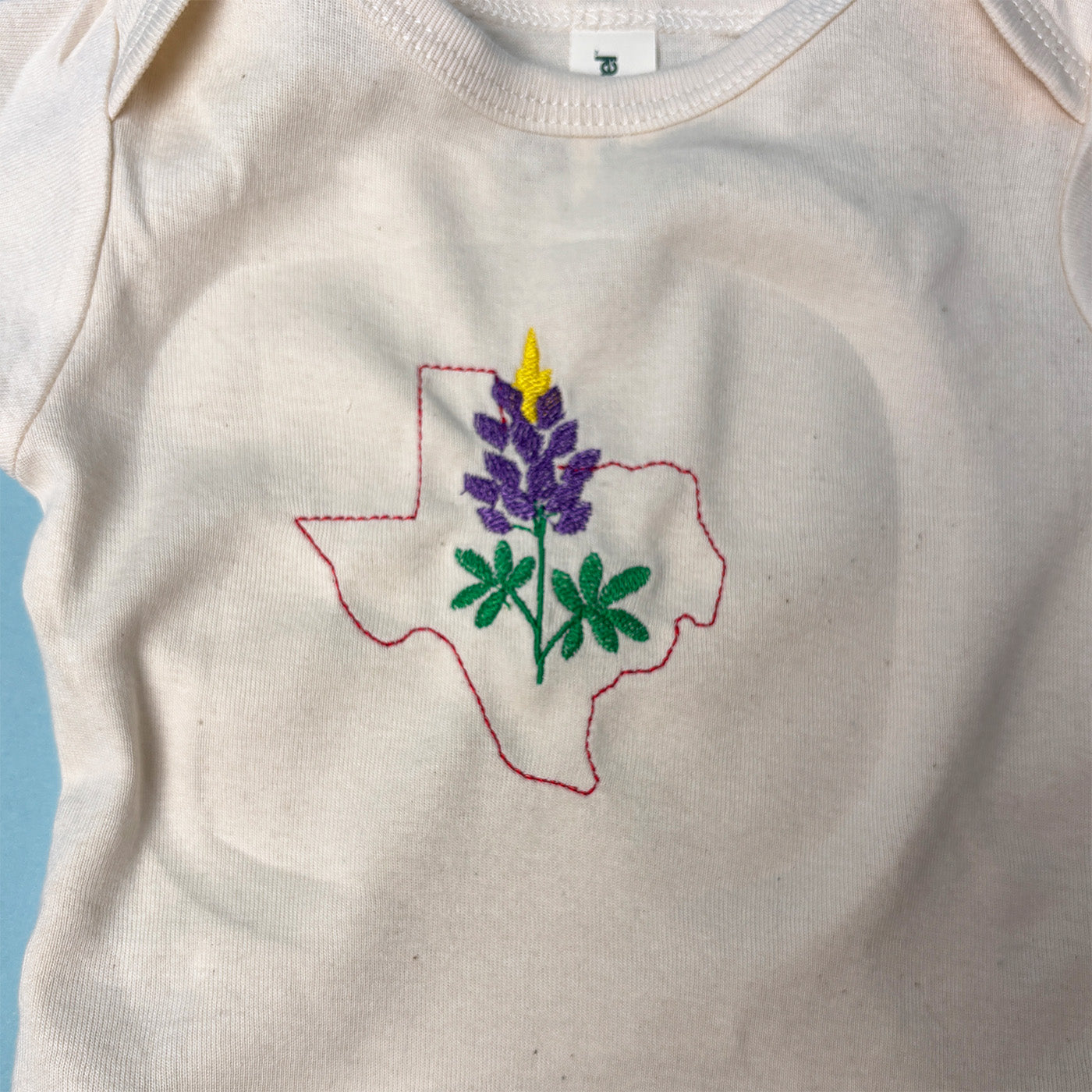 Texas Bluebonnet Onesie | Embroidered Texas State Outline | Organic Cotton Baby Bodysuit | Texas Baby Gift