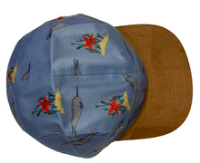 This image showcases the top of the blue hat.