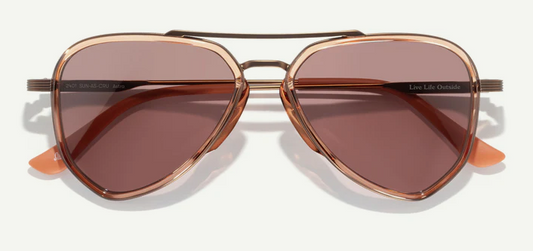 aviator shaped sunglasses with rose gold frame and brown lenses on a white background
