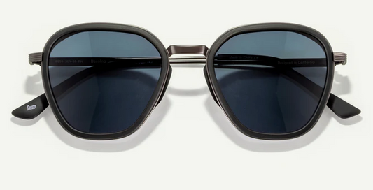 Black sunglasses with dark lenses on a white background