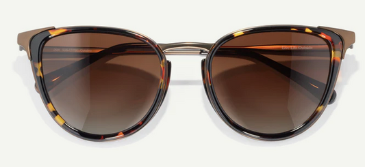 cateye sunglasses with tortoiseshell frame and brown lenses on a white background