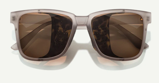 rectangular sunglasses with brown lenses and clear frame on a white background