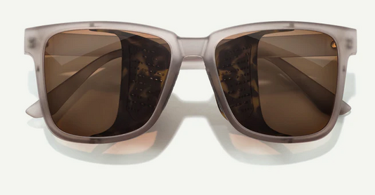 rectangular sunglasses with brown lenses and clear frame on a white background