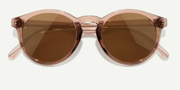 Round cateye sunglasses with brown lenses and rose gold frame on a white background