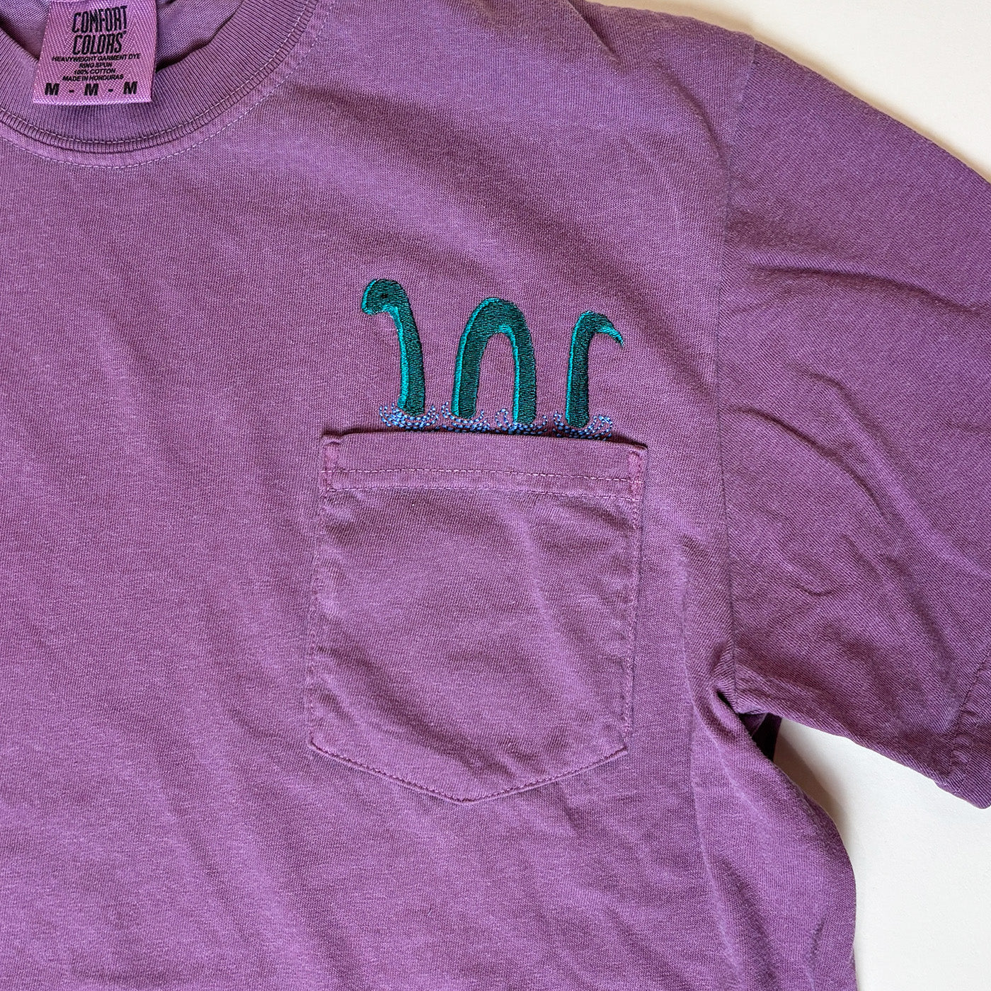 Loch Ness Monster Embroidered Pocket Tee | Unisex 100% Cotton T-Shirt
