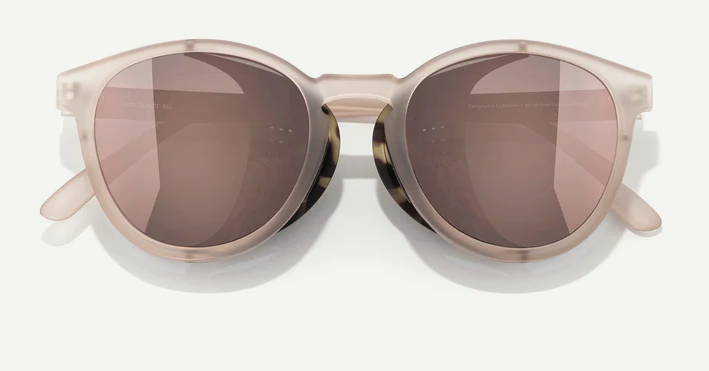 Sunglasses with a beige frame and brown lenses on a white background
