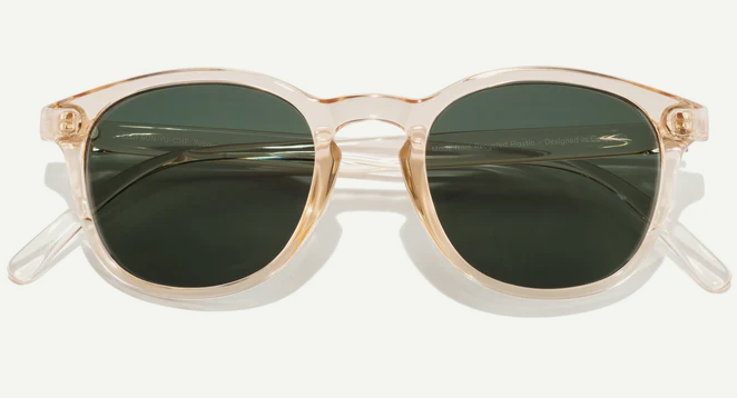 clear pinkish frames with deep green lenses