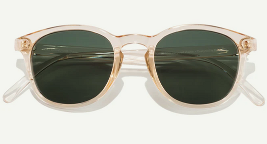 clear pinkish frames with deep green lenses