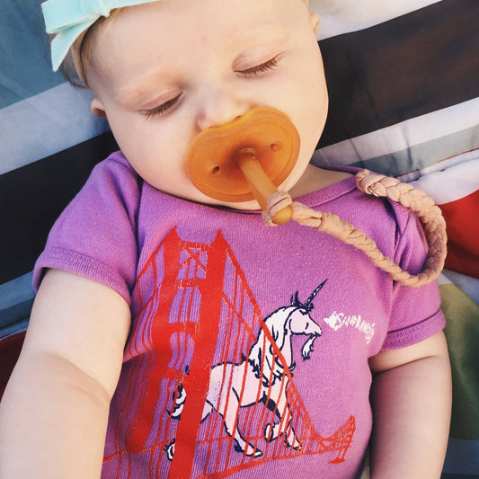Purple Unicorn On Golden Gate Bridge San Francisco baby onesie